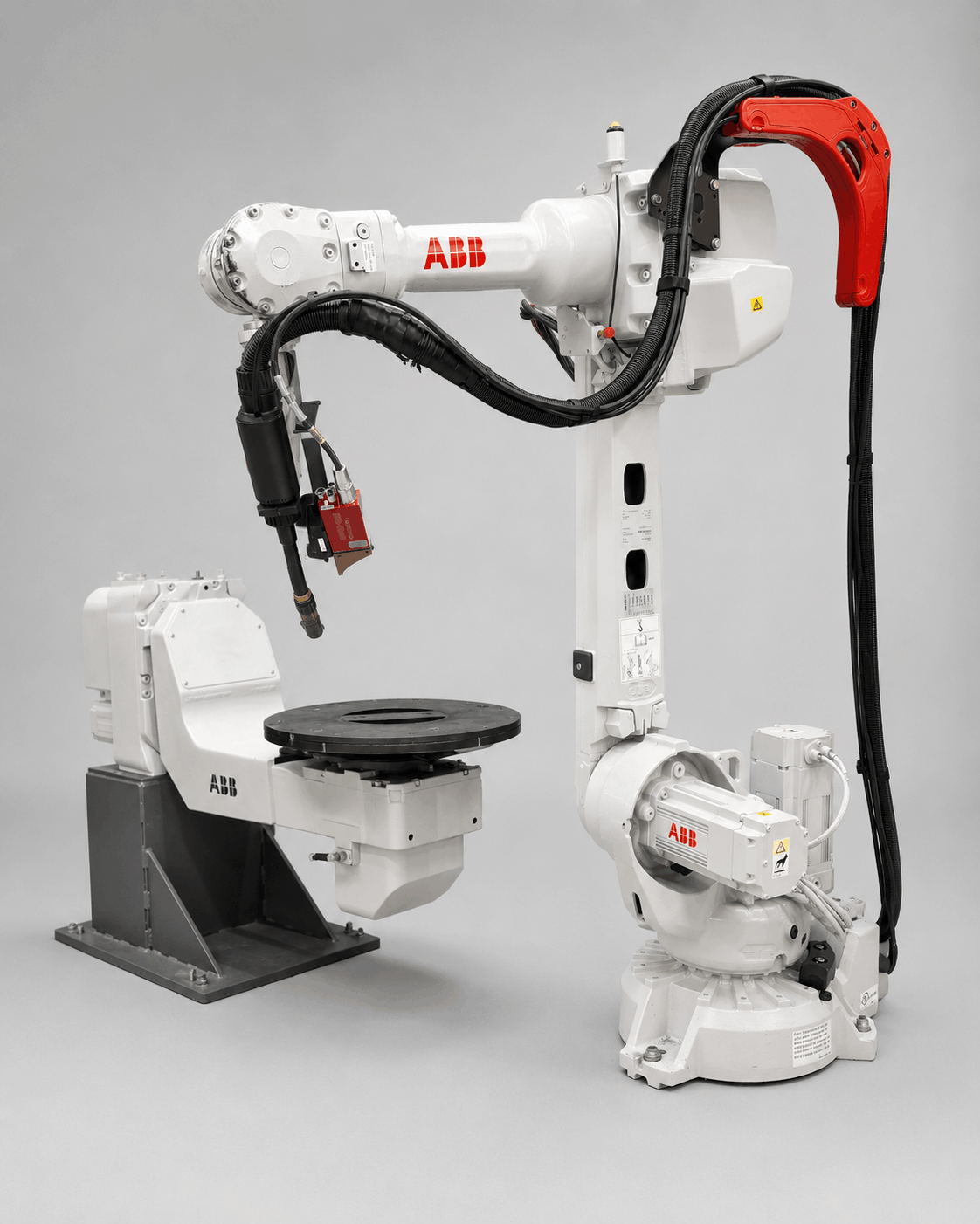Robot industriel ABB IRB 2600 à 6 axes avec positionneur pour le soudage automatisé de pièces métalliques